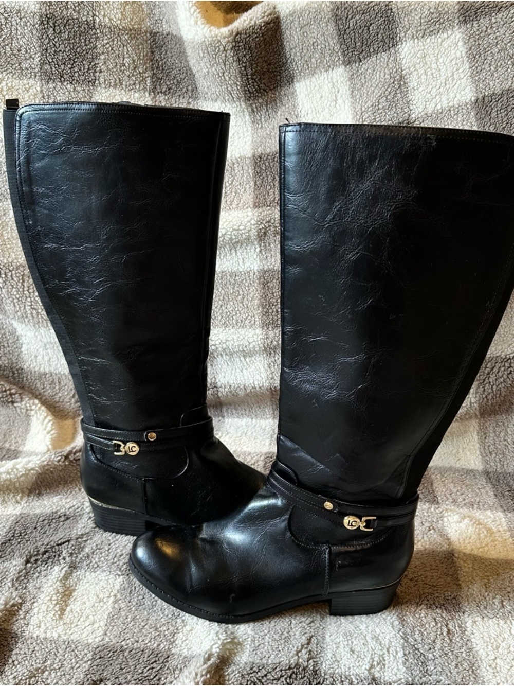 Black Leather Knee-High Riding Boots with Gold Accent